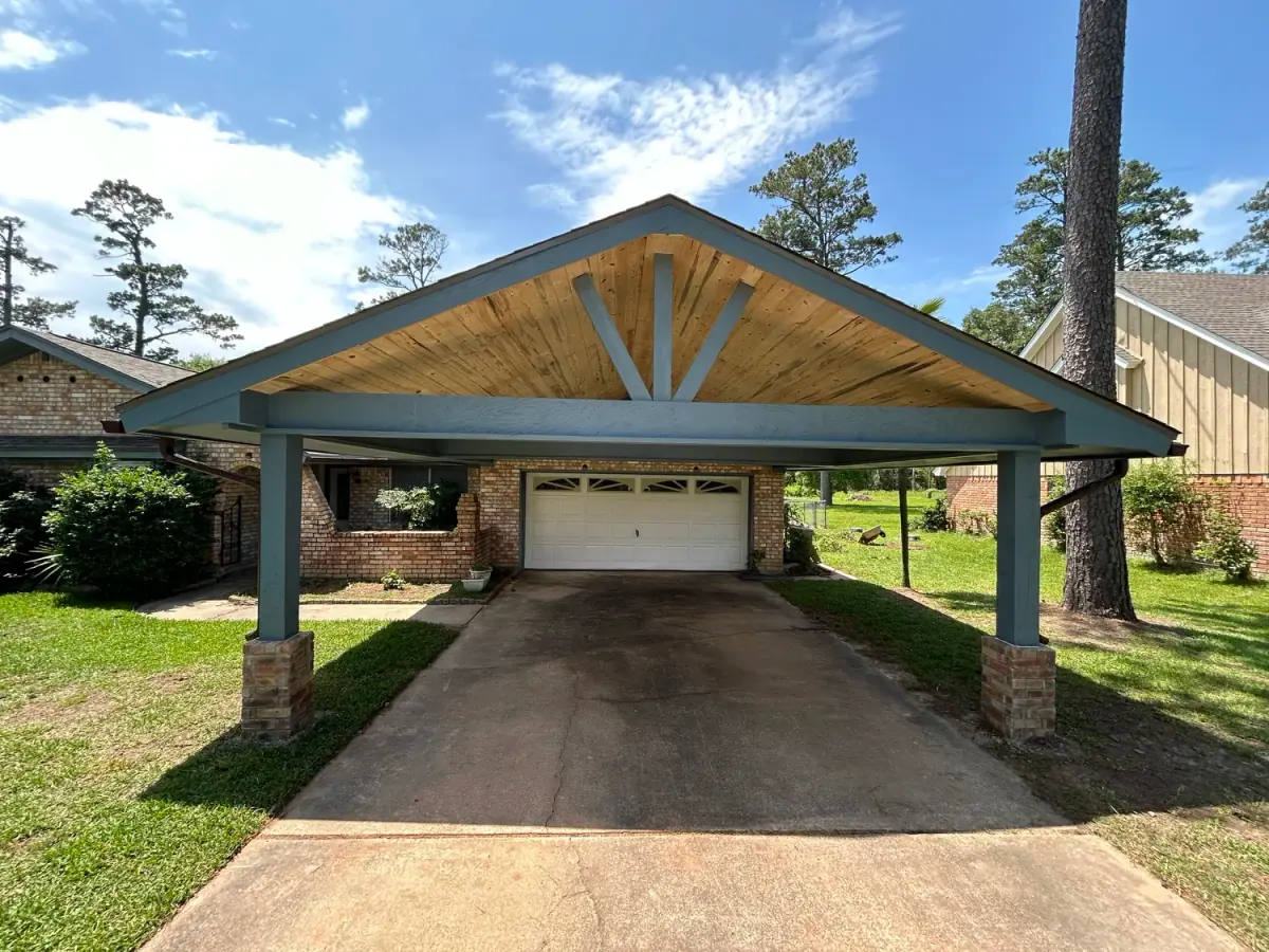 Painted timber carport with a fan truss over a driveway
