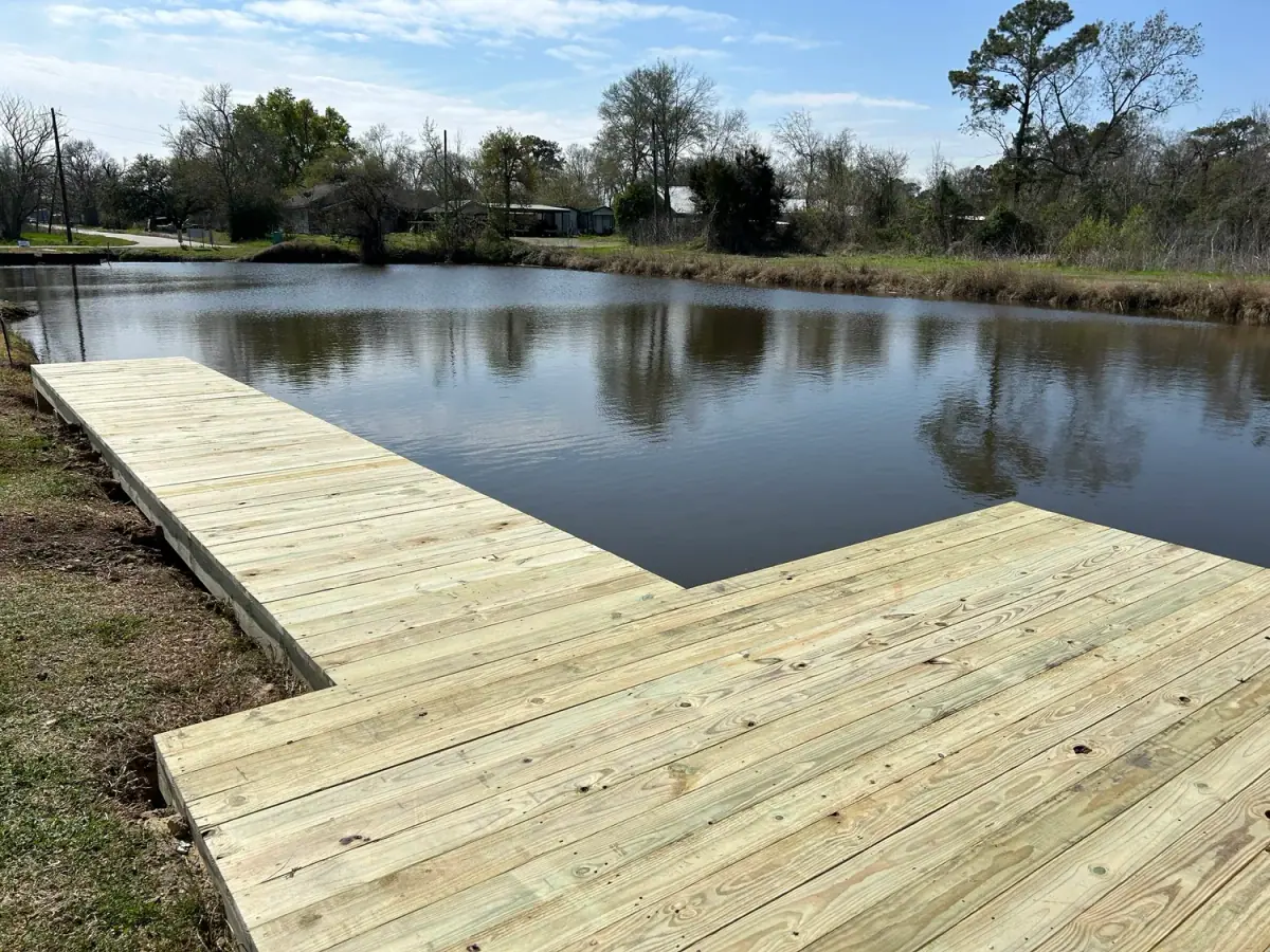 T-shaped treated-pine dock on a pond