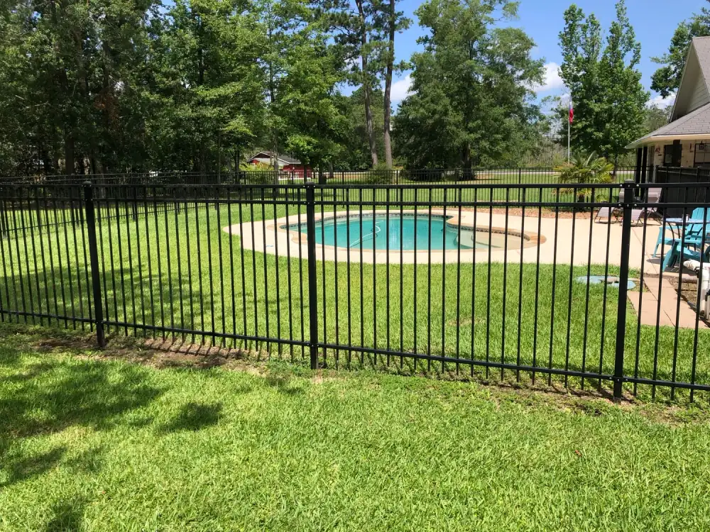 Black iron fence around a pool