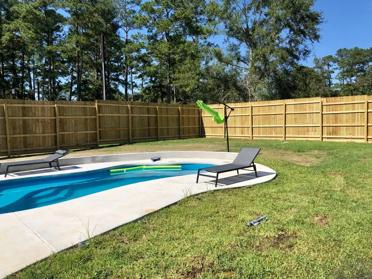 New privacy fence around a backyard pool