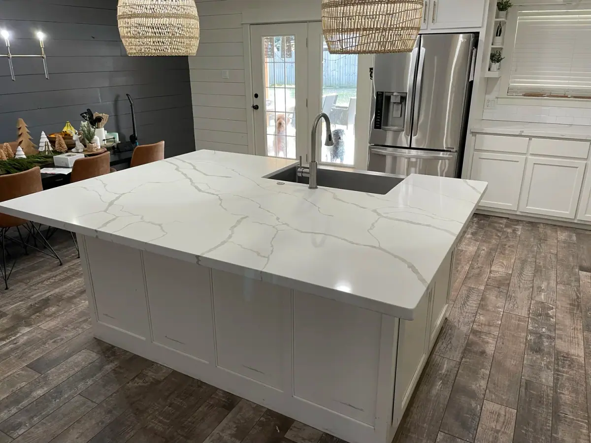 Kitchen remodel with a quartz island and woven pendant lights